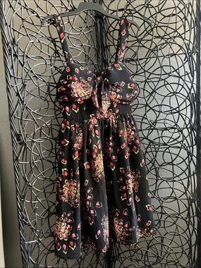 Black dress with peacock patter fabric
